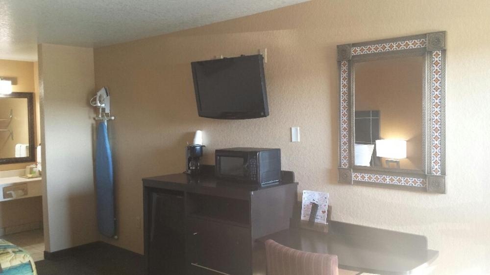 Media console mini fridge and cable TV at Hotel In Dilley